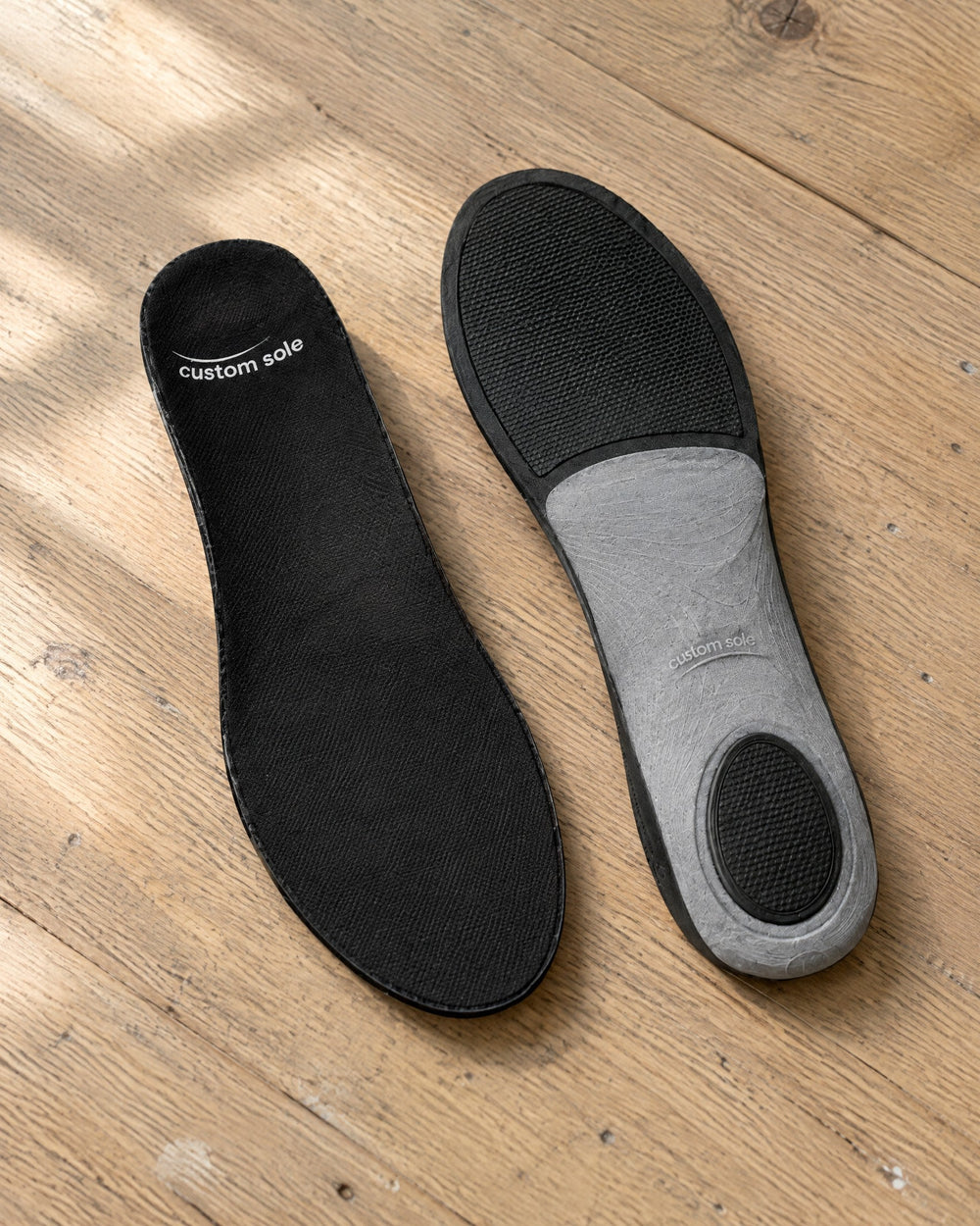 A finished pair of printed insoles side by side