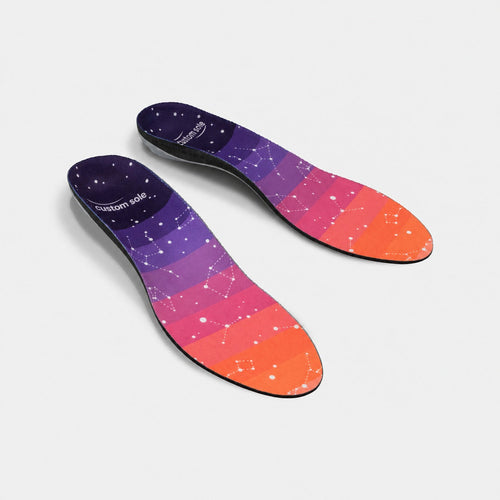 Constellation custom insoles shown at an angle to reveal the contoured arch and deep heel cup