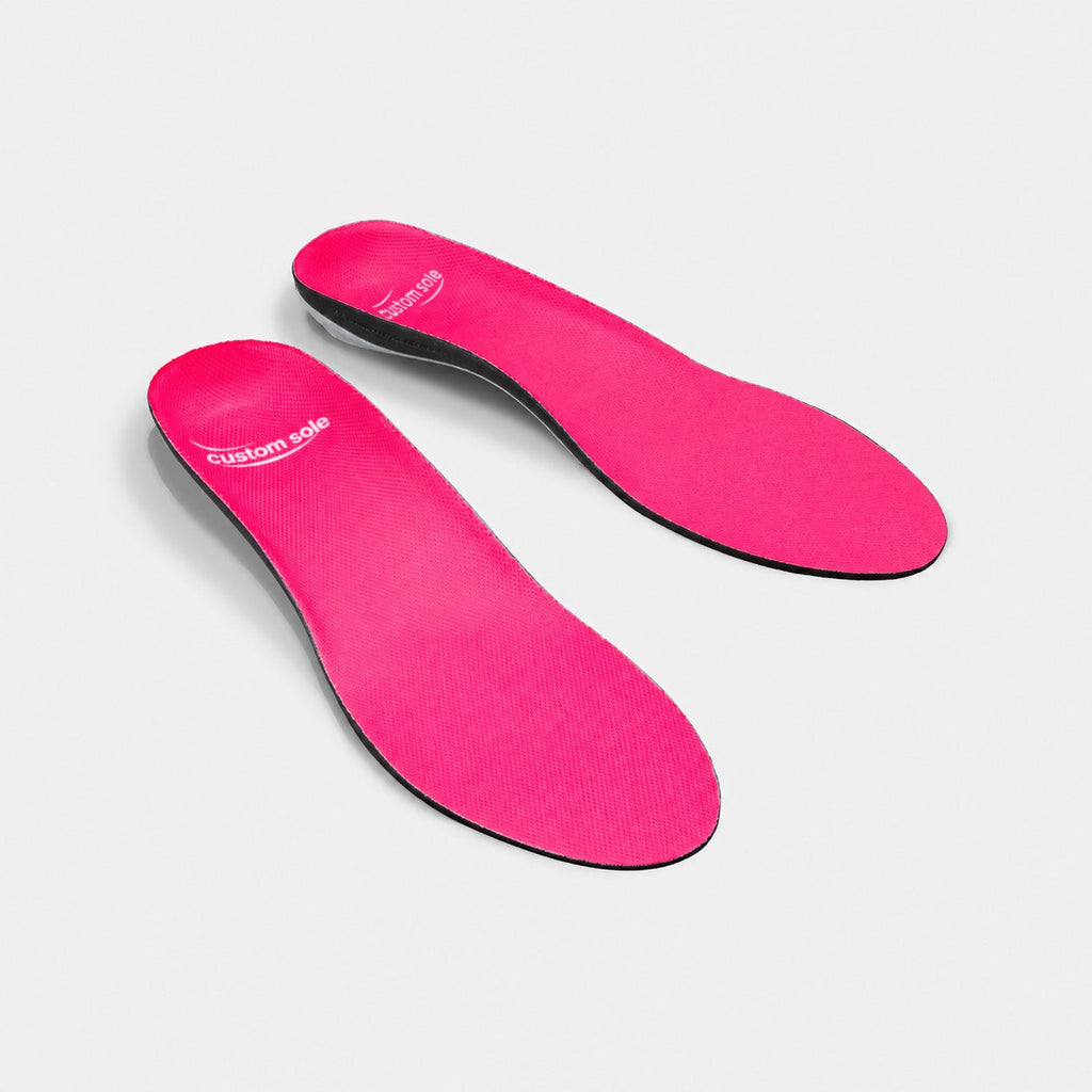 Dragonfruit custom insoles shown at an angle to reveal the contoured arch and deep heel cup