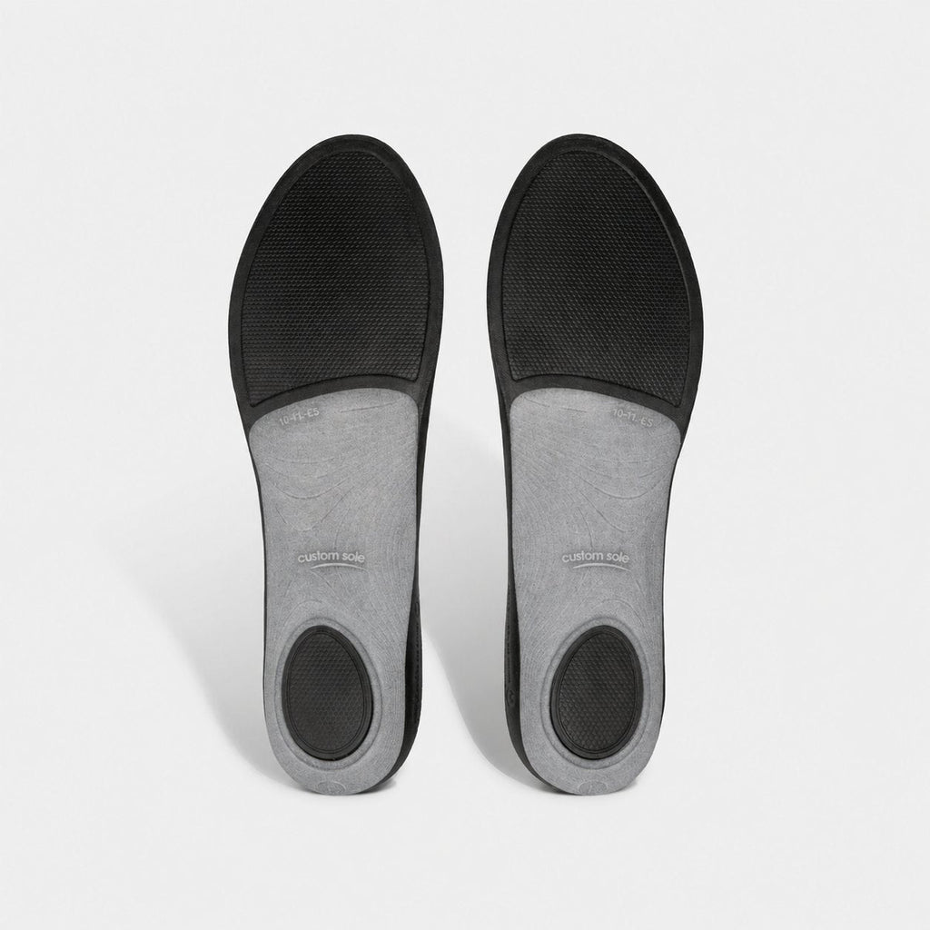 Underside of CustomSole full-length insoles: black base with grey arch shell and cushioned heel and forefoot pads