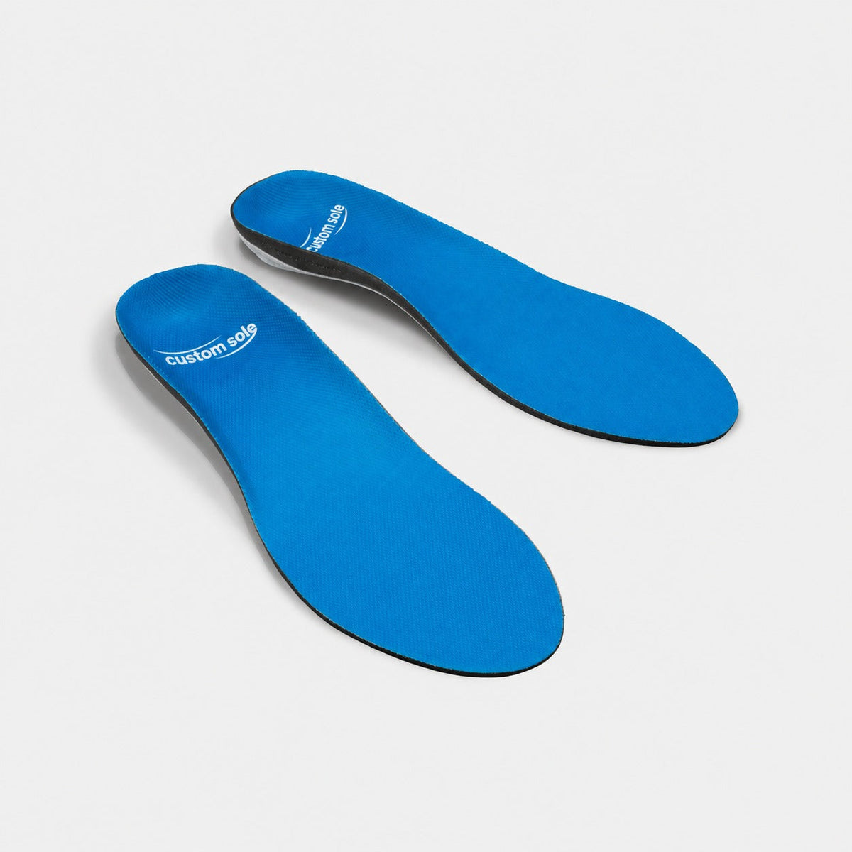 Lagoon custom insoles shown at an angle to reveal the contoured arch and deep heel cup