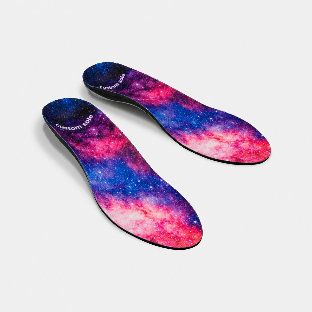 Nebula custom insoles shown at an angle to reveal the contoured arch and deep heel cup