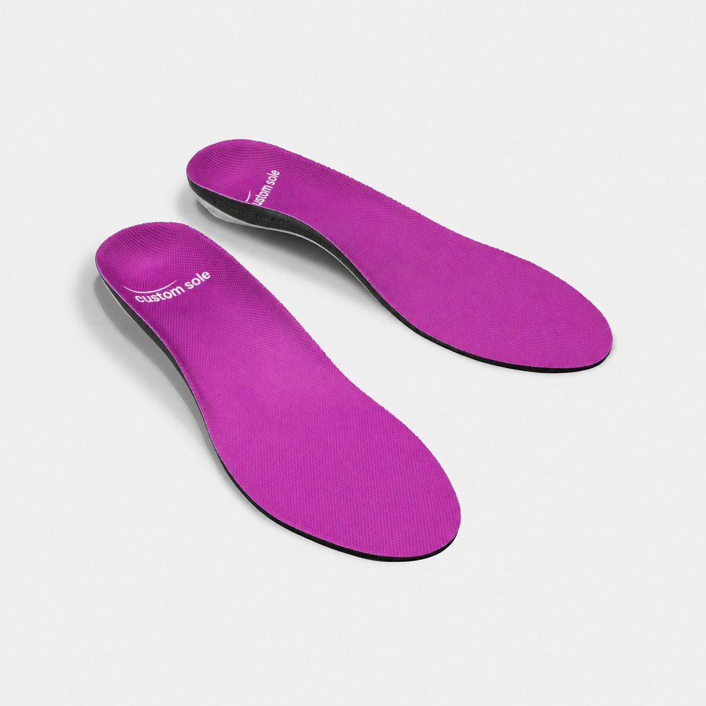 Orchid custom insoles shown at an angle to reveal the contoured arch and deep heel cup