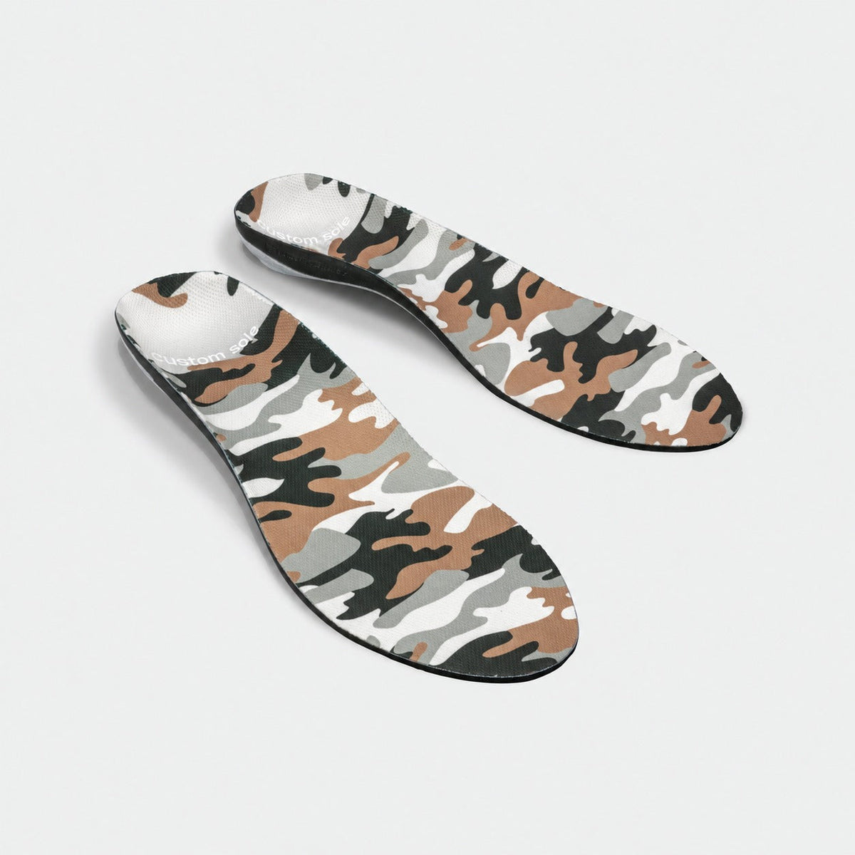 Outpost custom insoles shown at an angle to reveal the contoured arch and deep heel cup