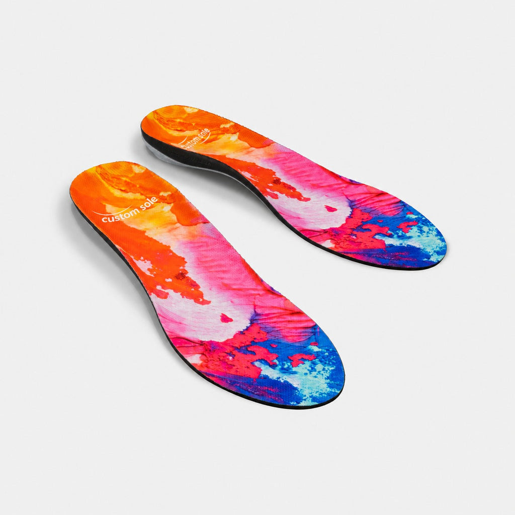 Solar Flare custom insoles shown at an angle to reveal the contoured arch and deep heel cup